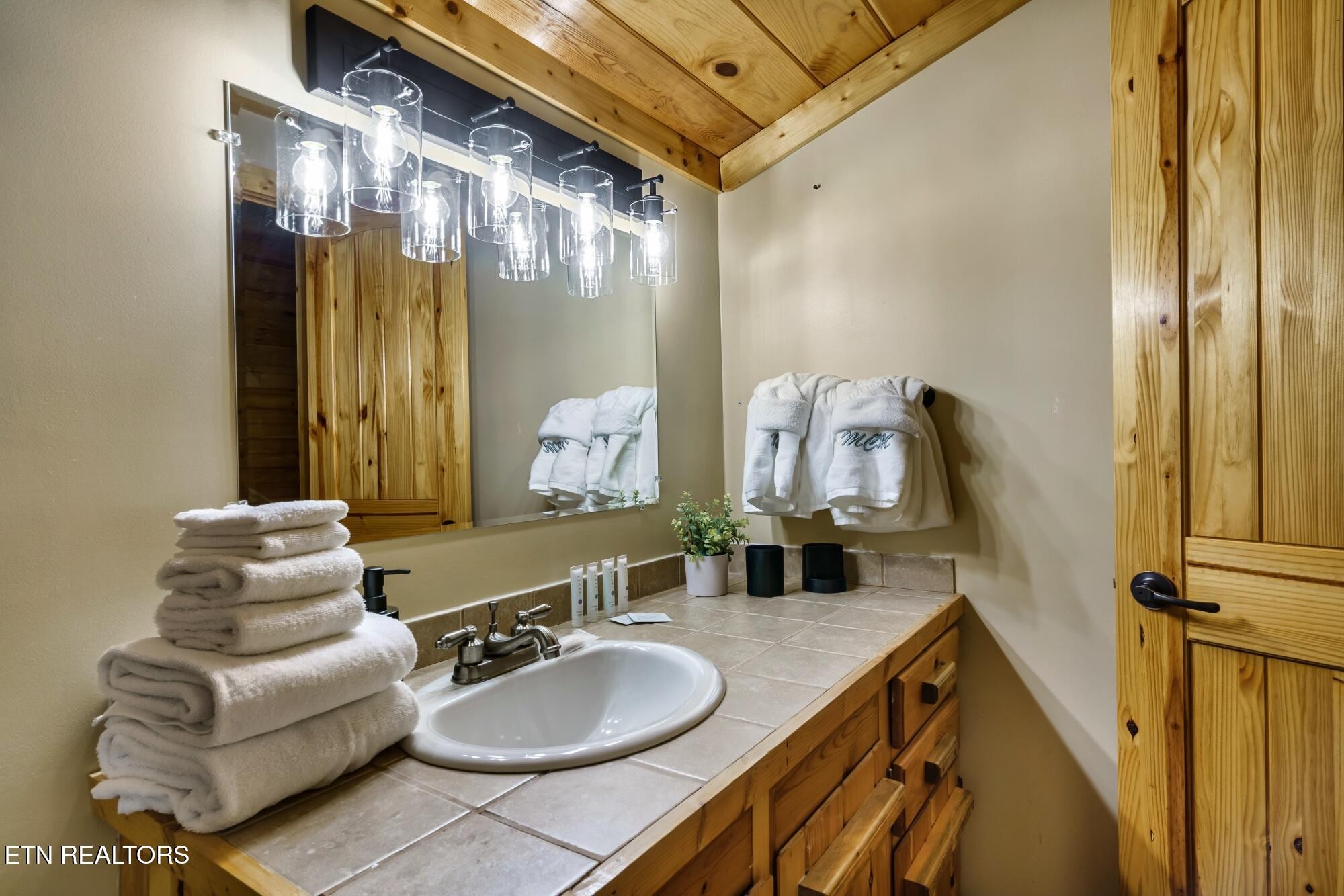 3330 Robeson Road Sevierville, TN 37862 - Photo 18 of 42 a bathroom with a sink mirror and vanity