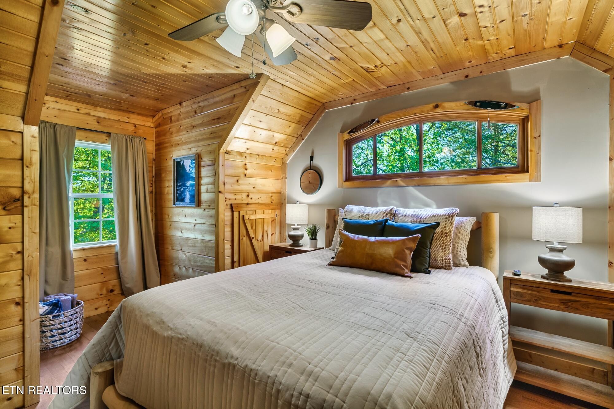 3330 Robeson Road Sevierville, TN 37862 - Photo 29 of 42 a bedroom with a bed and a large window