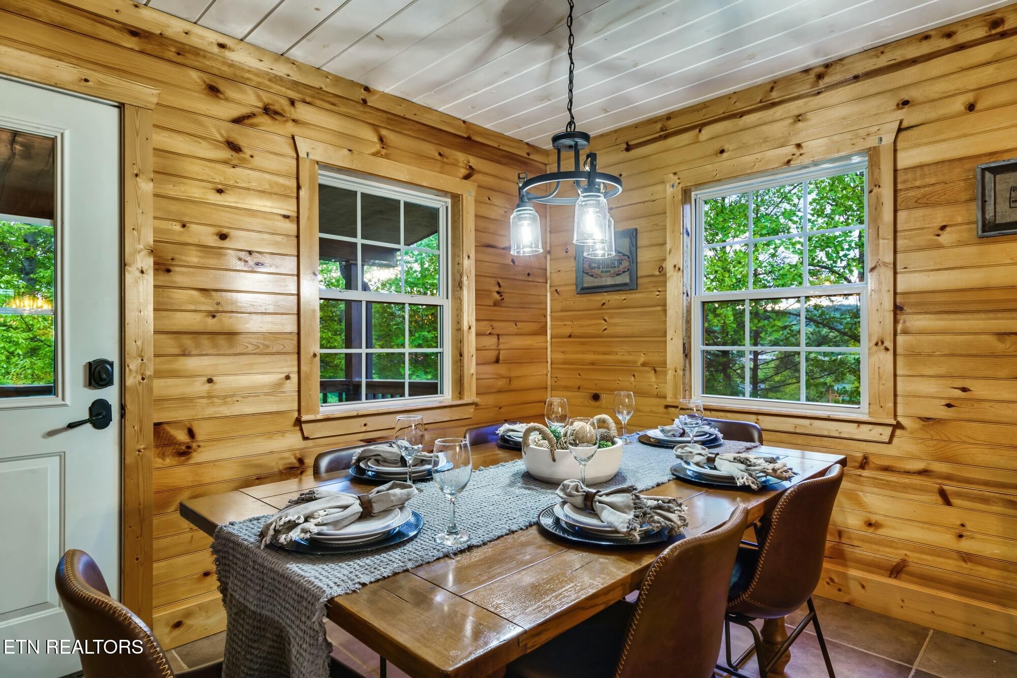 3330 Robeson Road Sevierville, TN 37862 - Photo 7 of 42 a table and chairs in front of a door