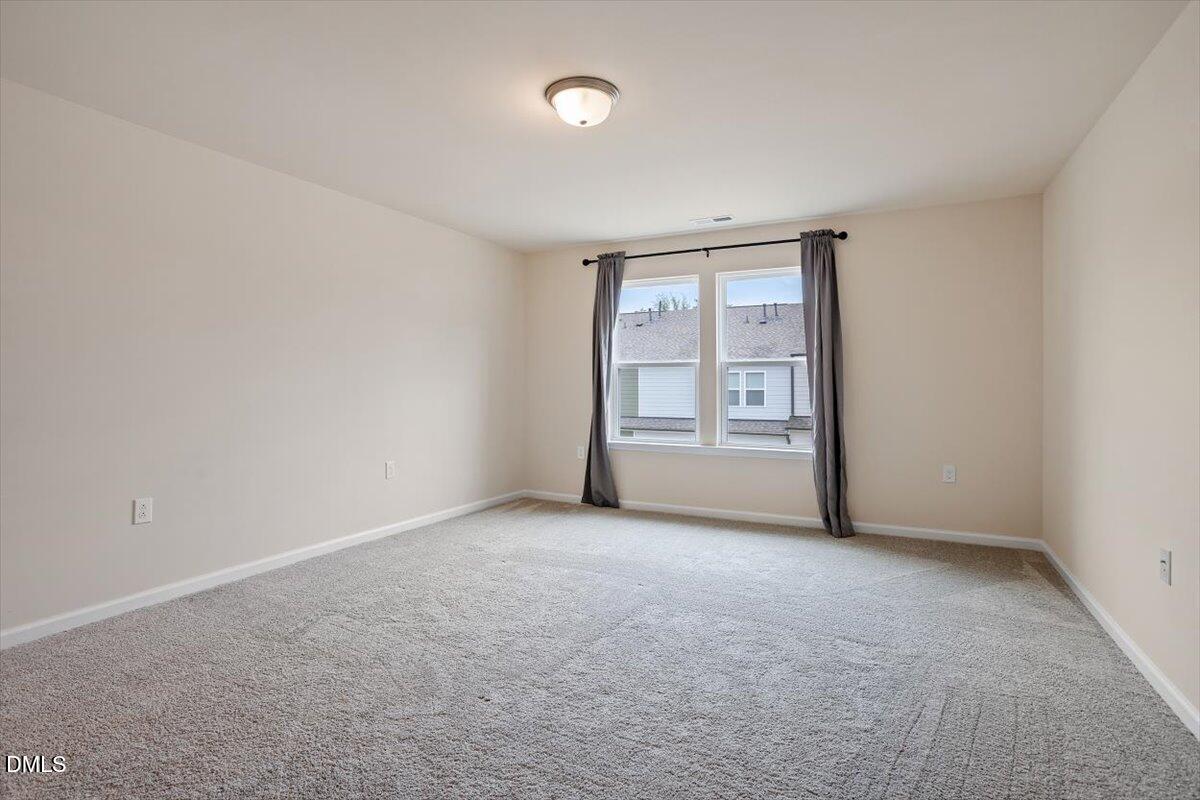 5702 Volos Avenue Raleigh, NC 27603 - Photo 23 of 34 Large Primary Bedroom