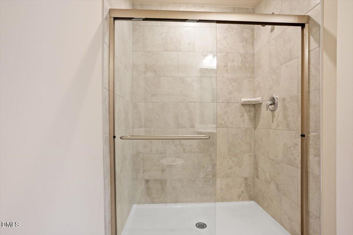 5702 Volos Avenue Raleigh, NC 27603 - Photo 26 of 34 Glass Shower Door with Tile Shower
