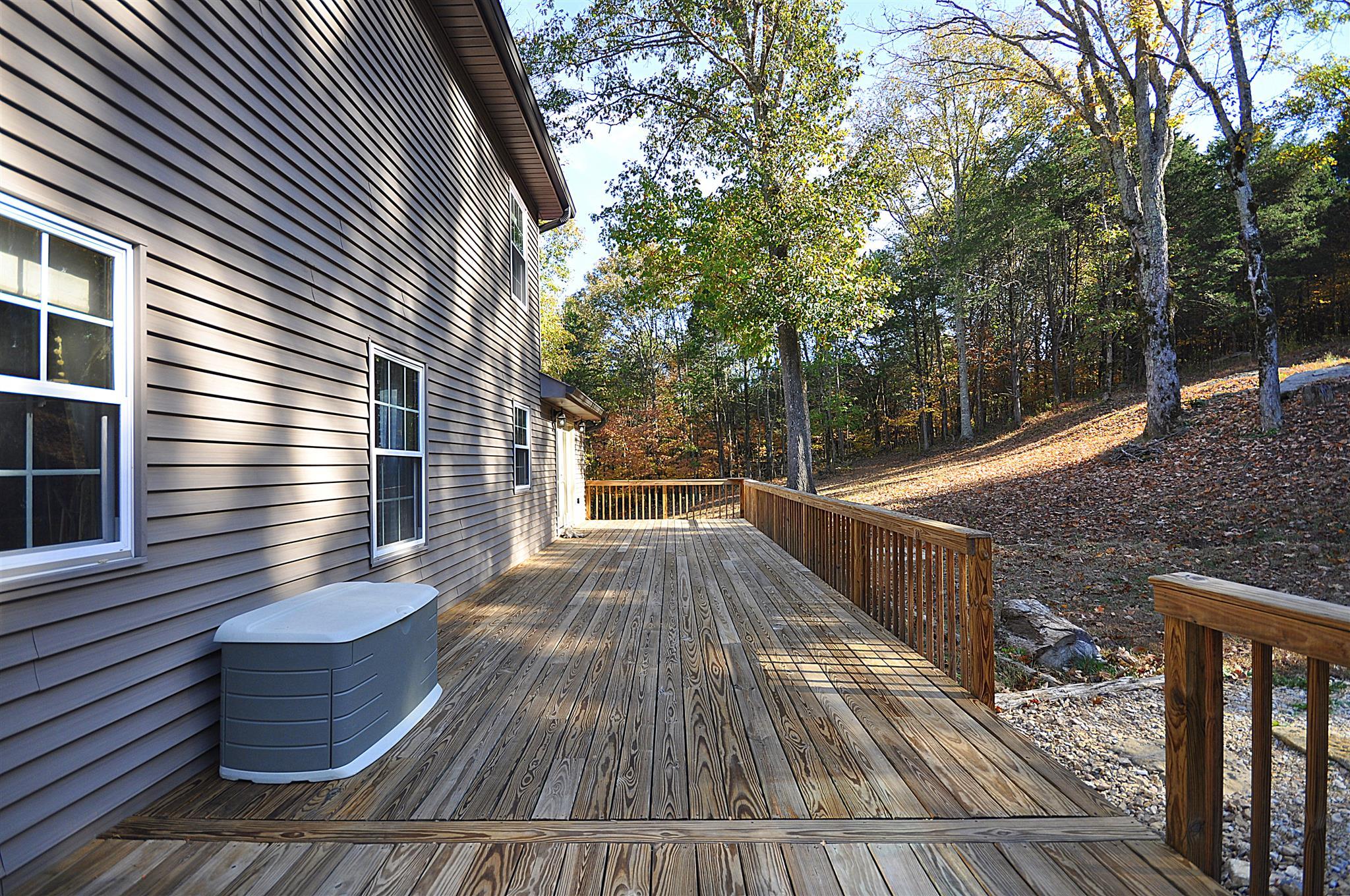 56 Buffalo Road Carthage, TN 37030 - Photo 20 of 22 a view of a roof deck with wooden floor and fence