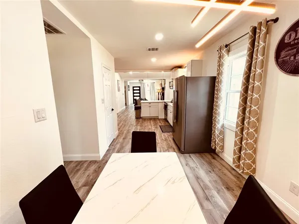 a bedroom with a bed and a mirror