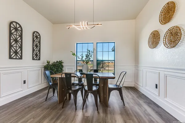 a view of an empty room with windows