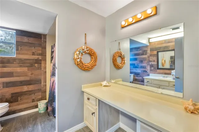 a bedroom with a bed and cupboard