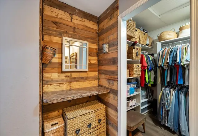 a living room with furniture and a ceiling fan