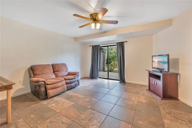 a view of a house with swimming pool and sitting area