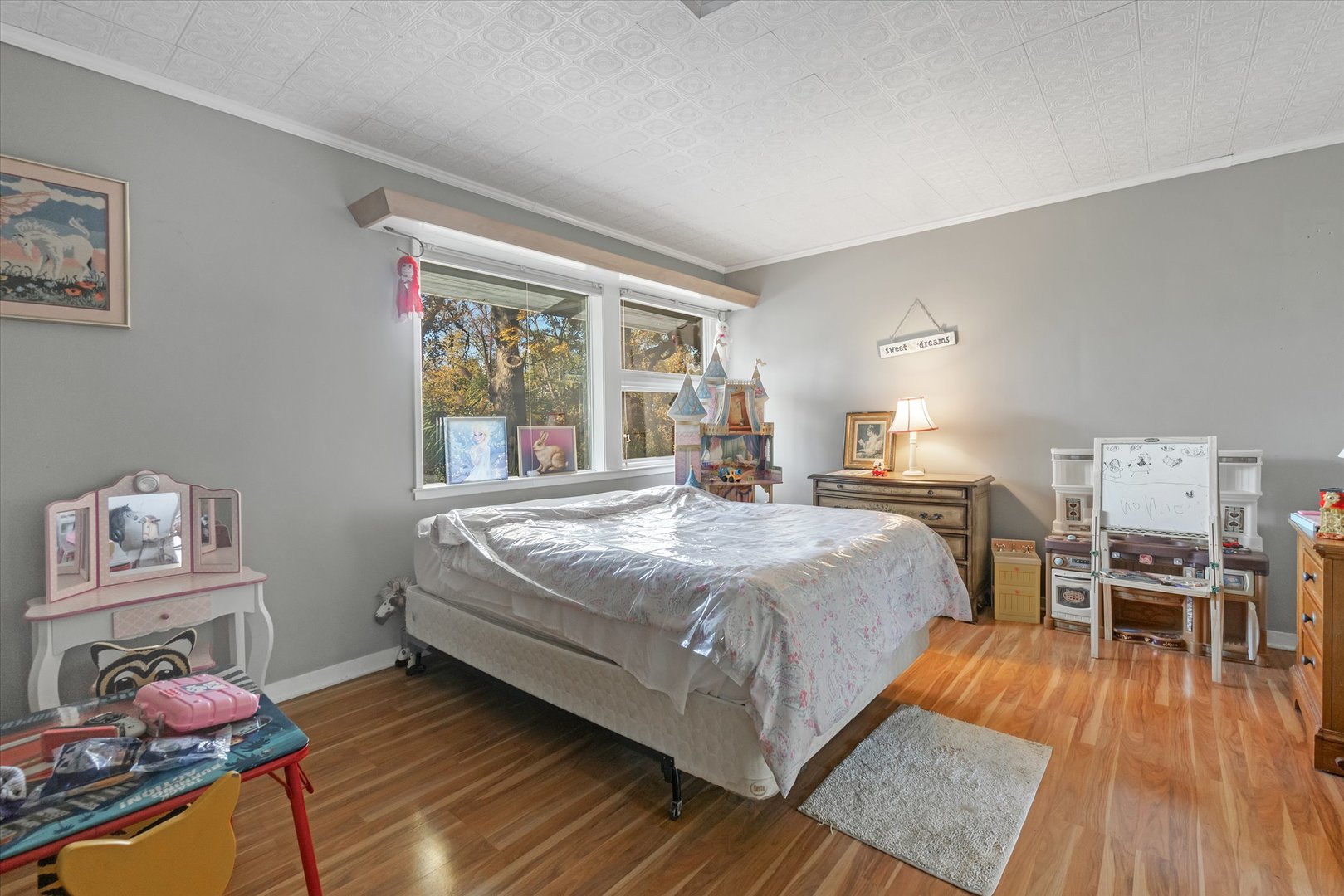 41W902 Hughes Road Elburn, IL 60119 - Photo 13 of 26 a bedroom with a bed and wooden floor