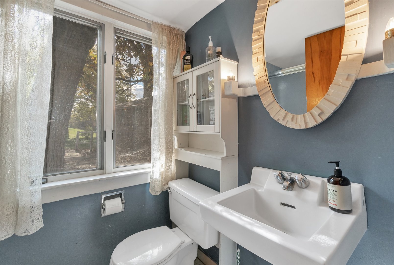 41W902 Hughes Road Elburn, IL 60119 - Photo 16 of 26 a bathroom with a toilet sink and mirror