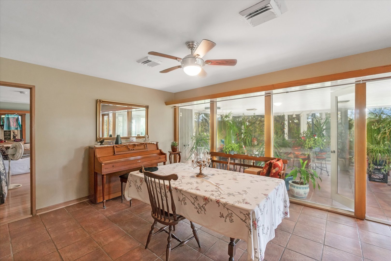 41W902 Hughes Road Elburn, IL 60119 - Photo 10 of 26 a dining room with furniture a chandelier and a rug