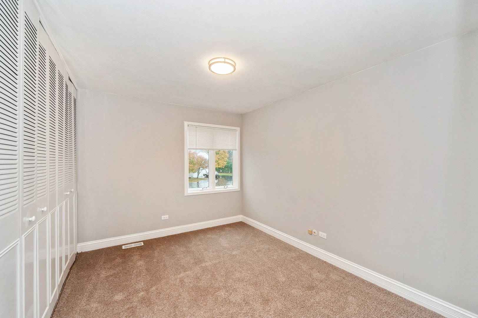 608 Inverrary Lane, Unit 608 Deerfield, IL 60015 - Photo 16 of 20 an empty room with windows