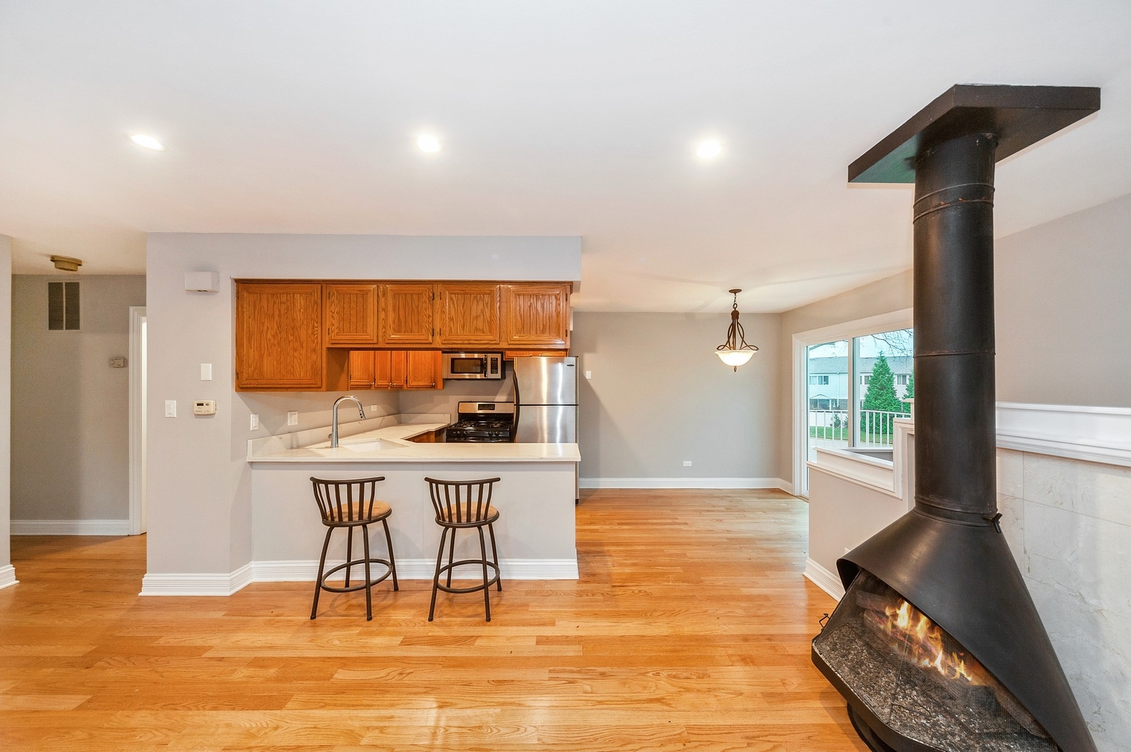 608 Inverrary Lane, Unit 608 Deerfield, IL 60015 - Photo 3 of 20 a view of a dining room with furniture window and wooden floor
