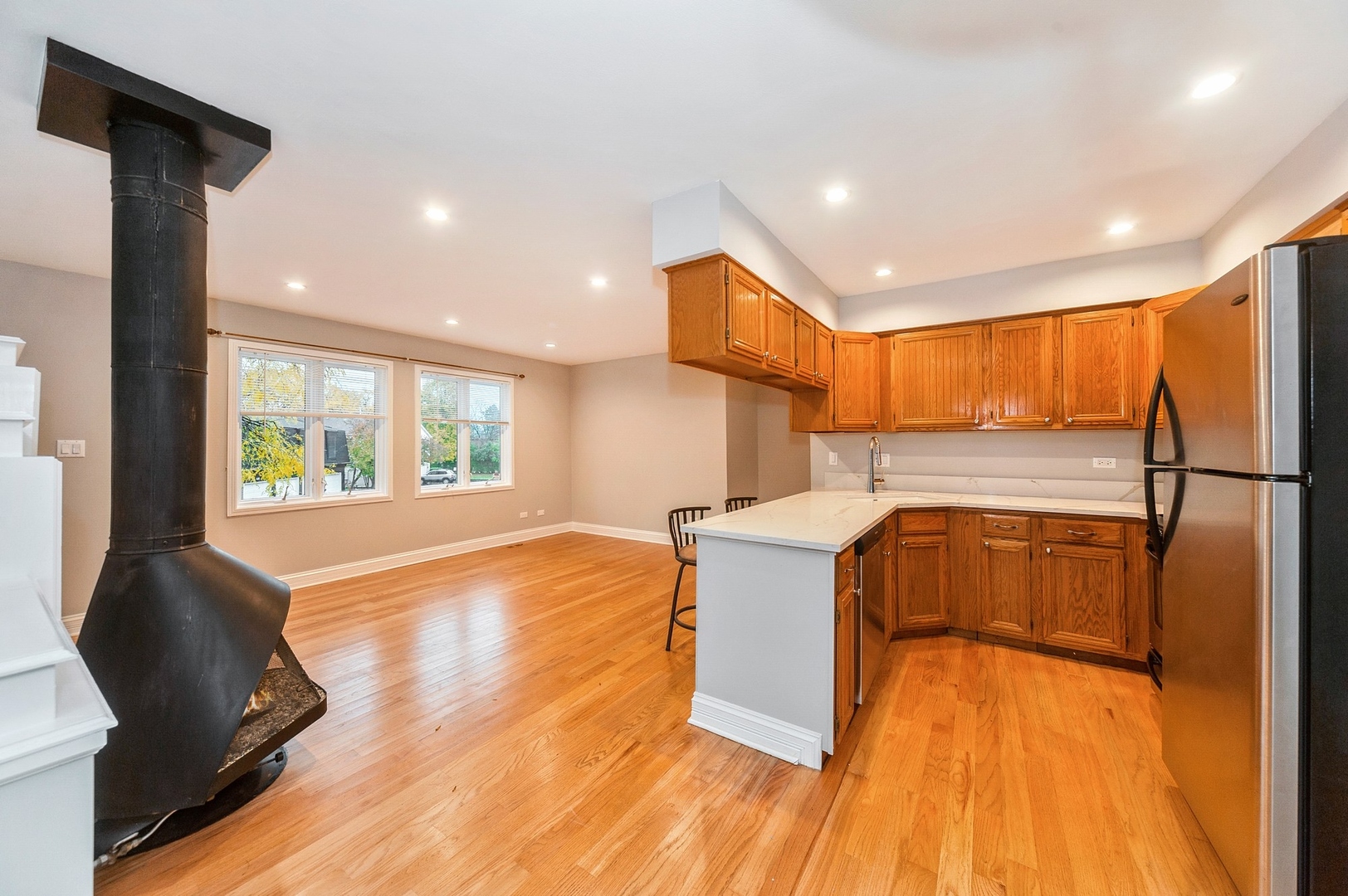 608 Inverrary Lane, Unit 608 Deerfield, IL 60015 - Photo 7 of 20 a view of a kitchen with a large window and wooden floor