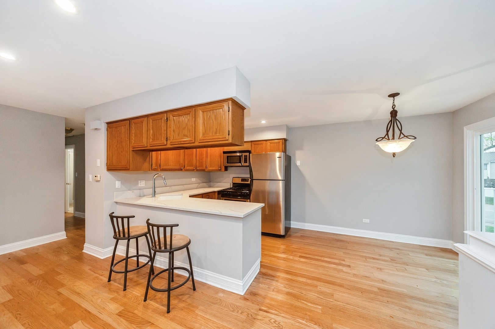 608 Inverrary Lane, Unit 608 Deerfield, IL 60015 - Photo 8 of 20 a kitchen with a sink cabinets and window