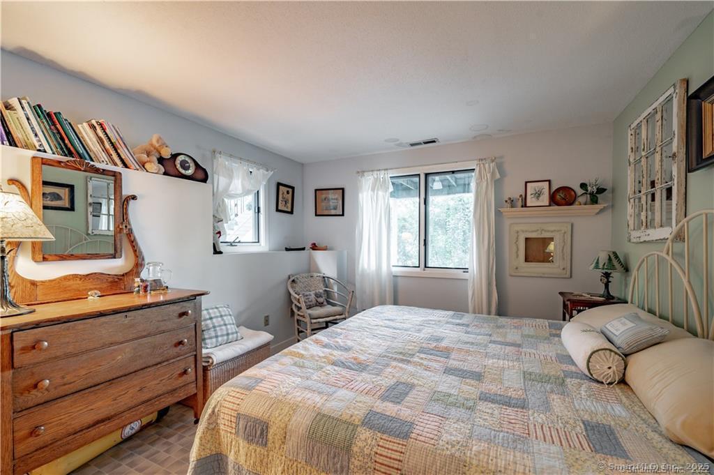 166 Old Colchester Road Salem, CT 06420 - Photo 13 of 13 a bedroom with a bed and a dresser in it