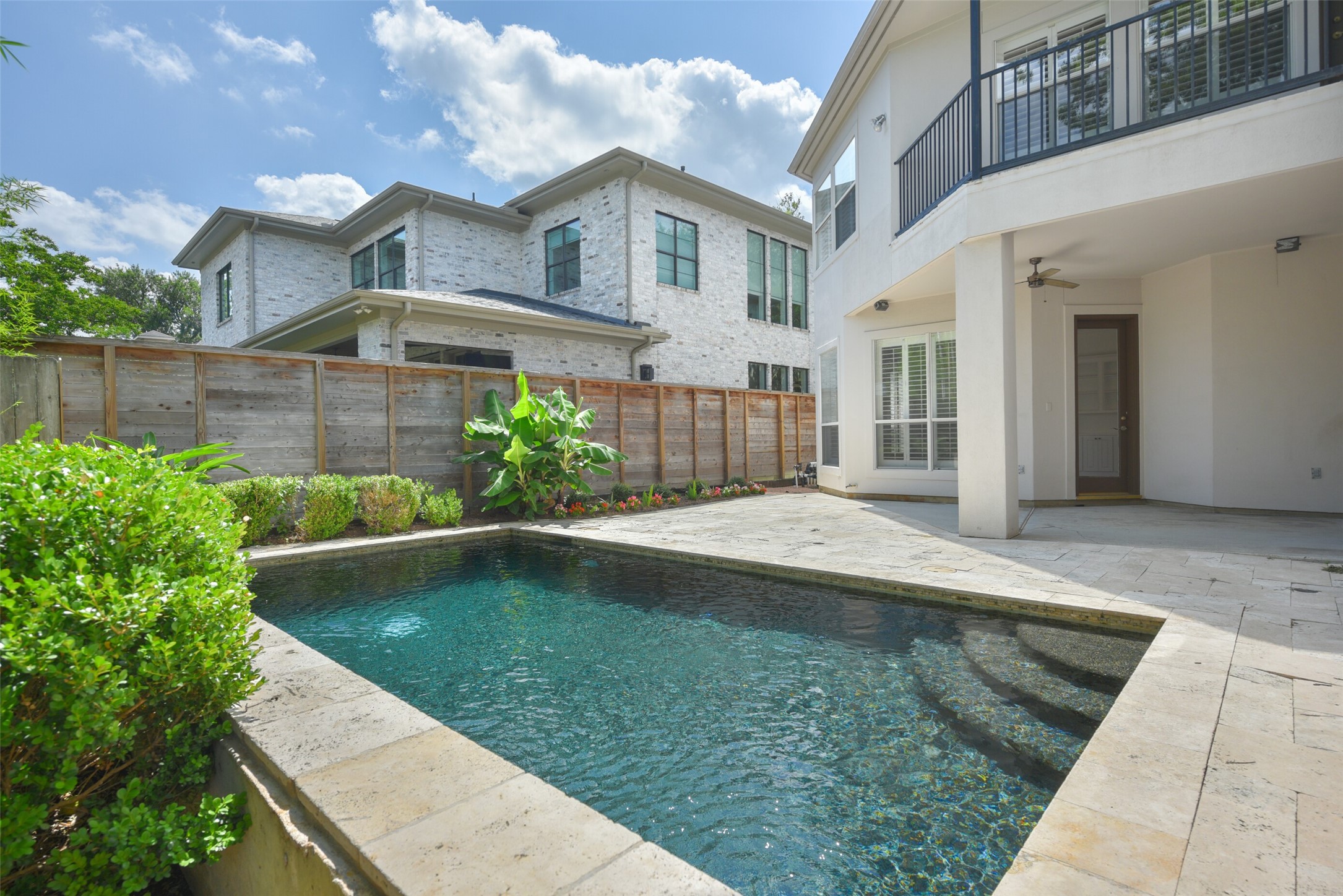 3724 Wroxton Road Houston, TX 77005 - Photo 37 of 40 Landscaped and fully-fenced backyard with covered patio and sparkling pool.