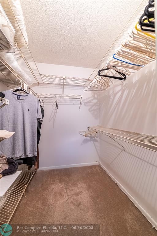 8305 Northwest 61st Street, Unit C215 Tamarac, FL 33321 - Photo 15 of 28 a view of a room with racks on the wall