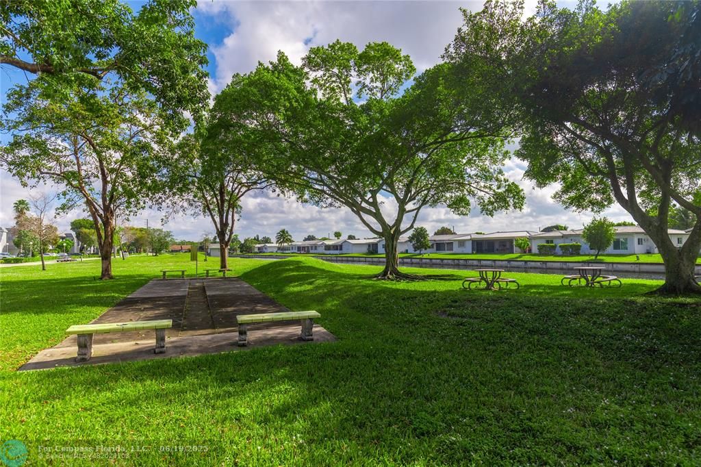 8305 Northwest 61st Street, Unit C215 Tamarac, FL 33321 - Photo 28 of 28 a park with tall trees