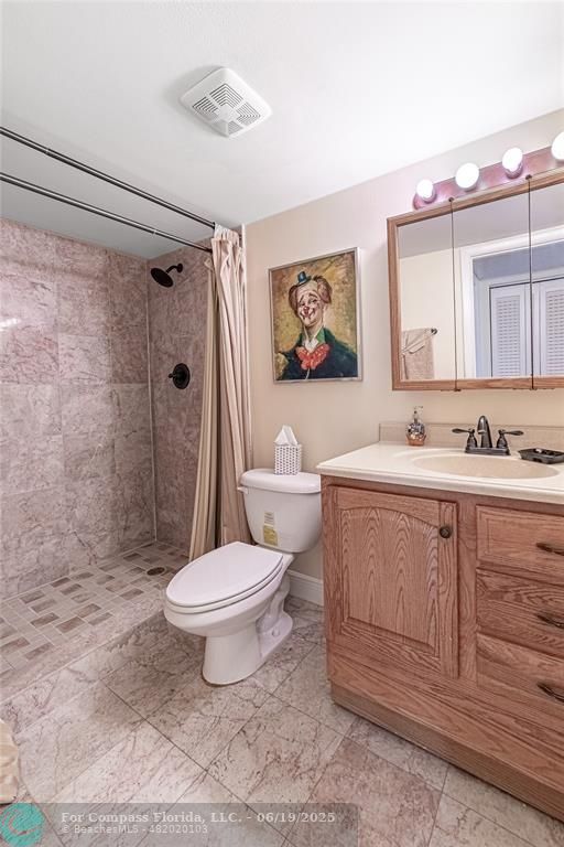 8305 Northwest 61st Street, Unit C215 Tamarac, FL 33321 - Photo 8 of 28 a bathroom with a sink toilet and shower