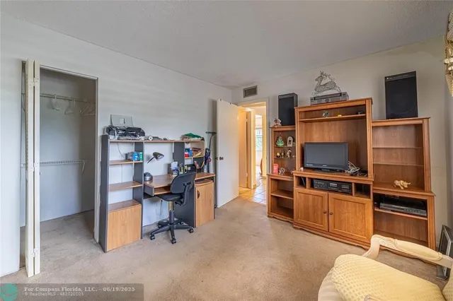 a bed room with a bed and a window