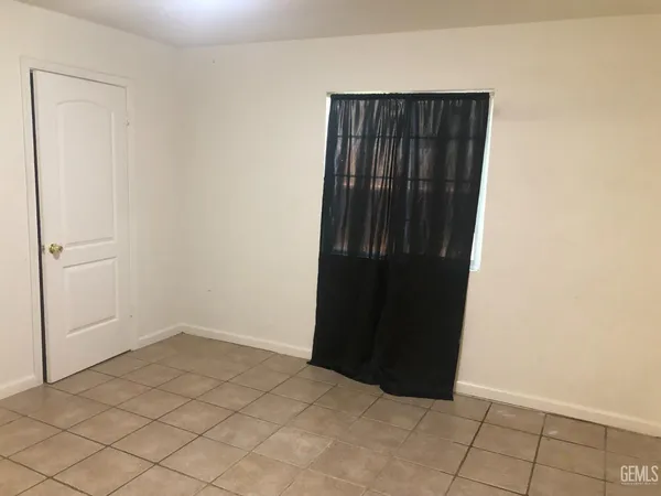 an empty room with wooden floor