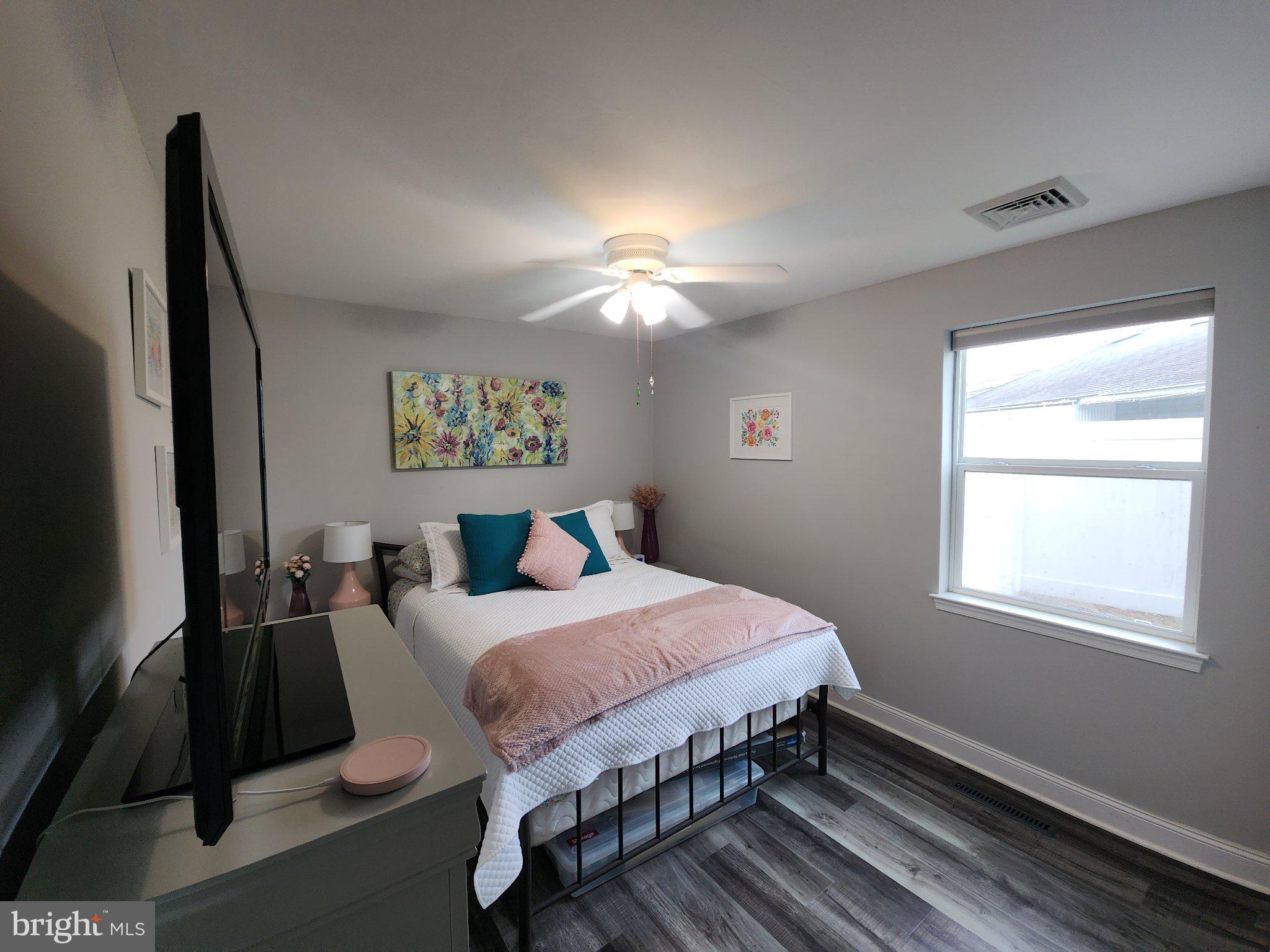 802 Devon Road Riverside, NJ 08075 - Photo 11 of 29 a bedroom with a bed and a chandelier