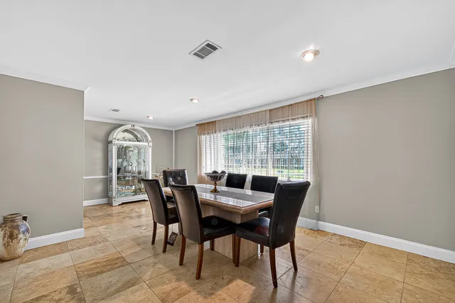 a view of a dining room with furniture window and outside view