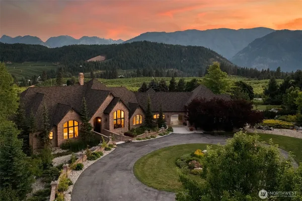 an aerial view of a house with mountain view