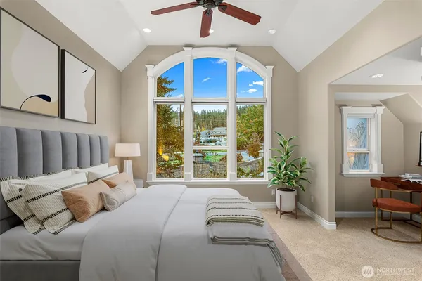 a bed room with a bed and a chair