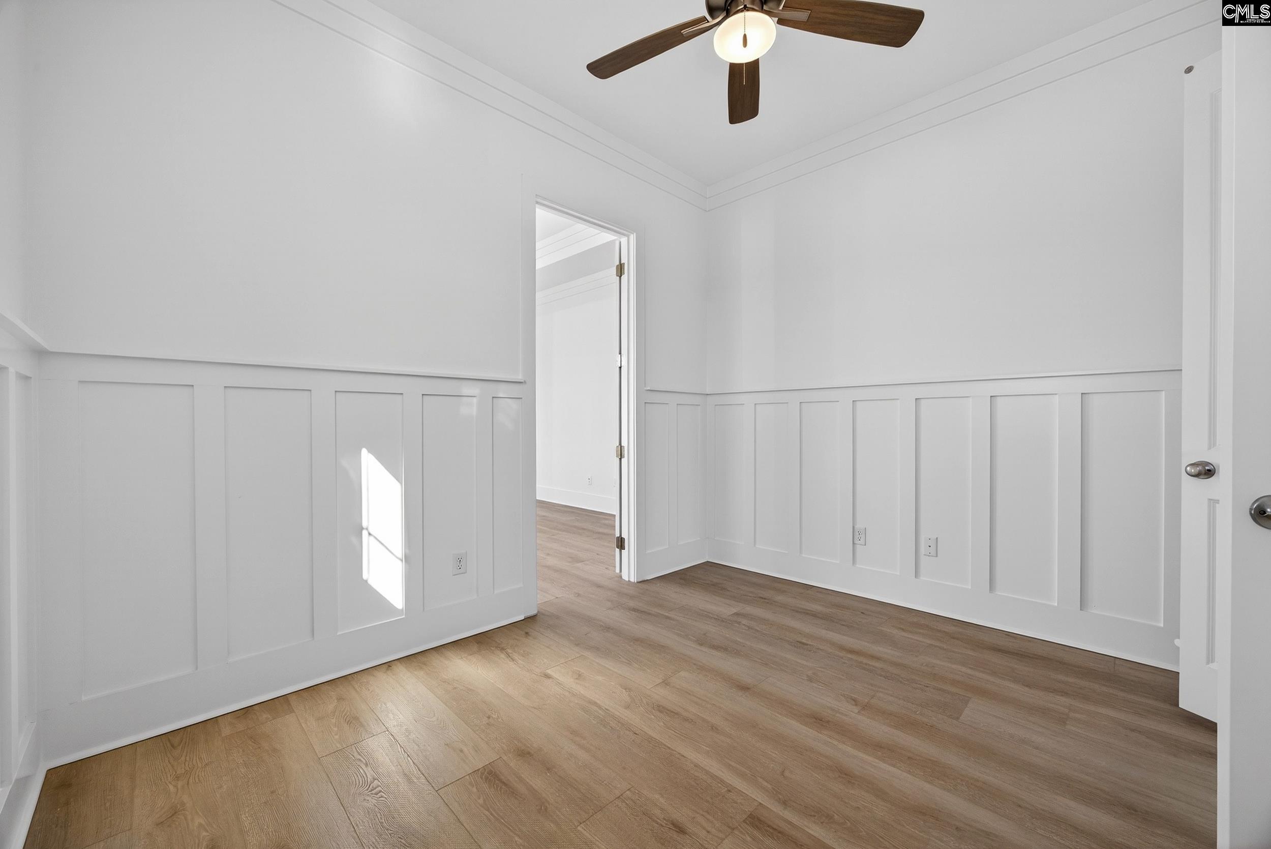 1318 Long Grove Way Lexington, SC 29072 - Photo 46 of 90 an empty room with wooden floor fan and windows