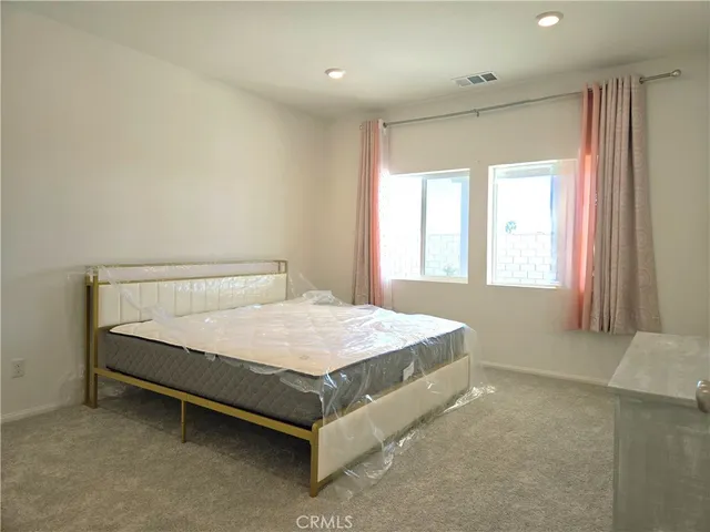 a kitchen with stainless steel appliances granite countertop a sink stove and microwave