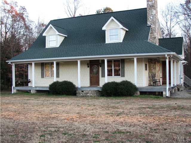 301 Pilot-Riley Road Zebulon, NC 27597 - Photo 1 of 15 a house that has a lot of windows in it
