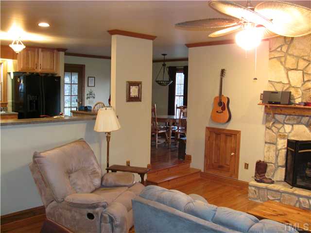 301 Pilot-Riley Road Zebulon, NC 27597 - Photo 12 of 15 a living room with furniture and a fireplace