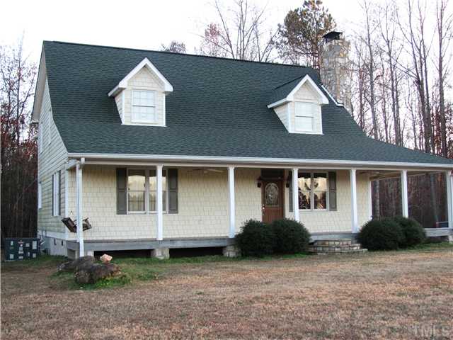 301 Pilot-Riley Road Zebulon, NC 27597 - Photo 2 of 15 a front view of a house with a yard and garage