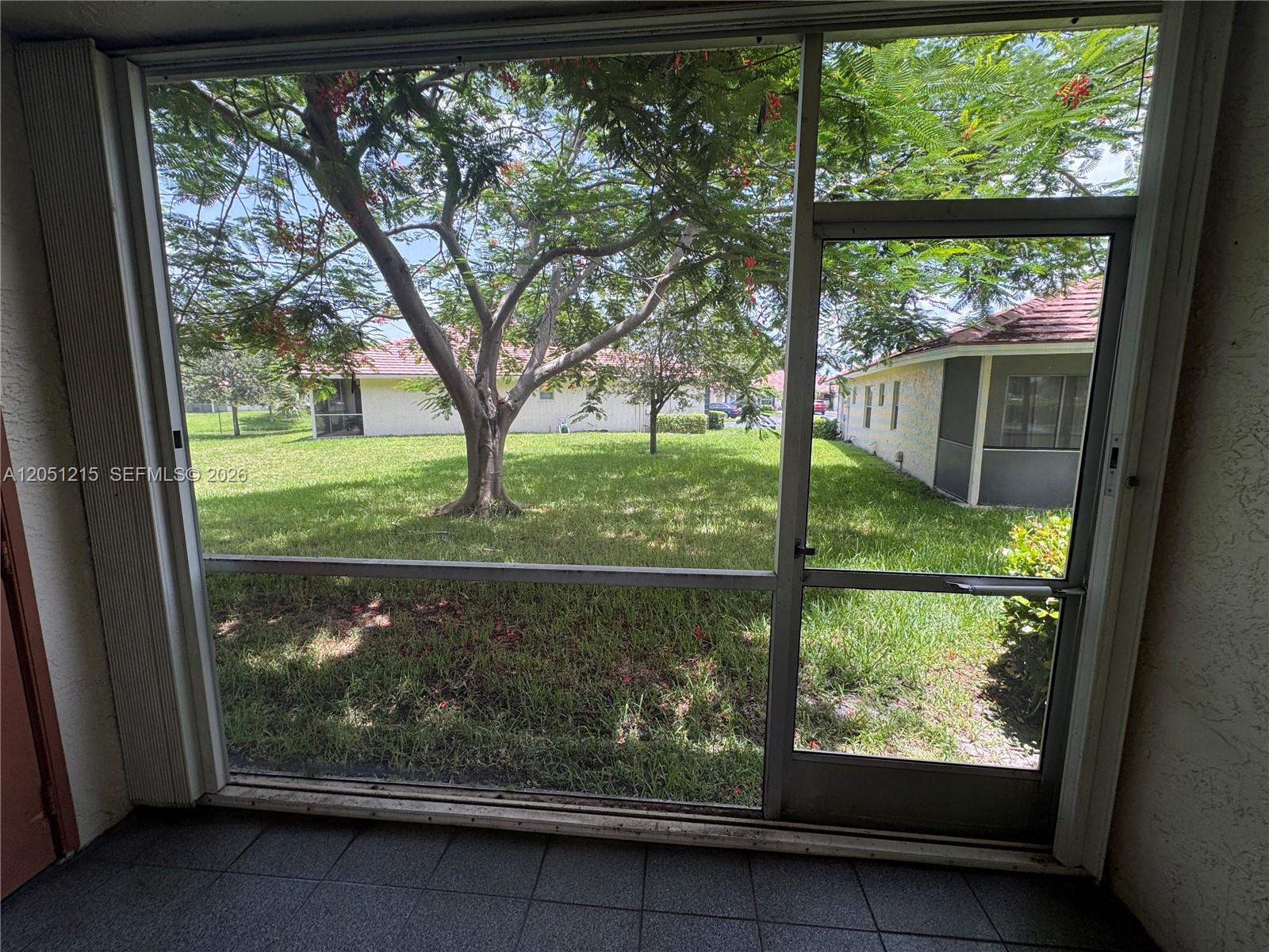 9937 Three Lakes Circle, Unit 14D Boca Raton, FL 33428 - Photo 7 of 22 Garden view living room view