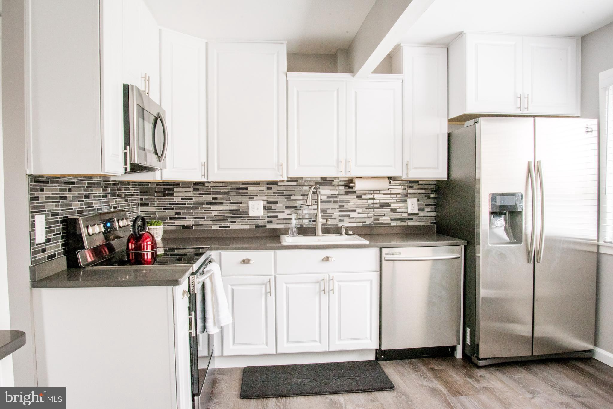 8521 Jenner Court Springfield, VA 22153 - Photo 8 of 20 Updated Premium Kitchen with New Stainless Steel.