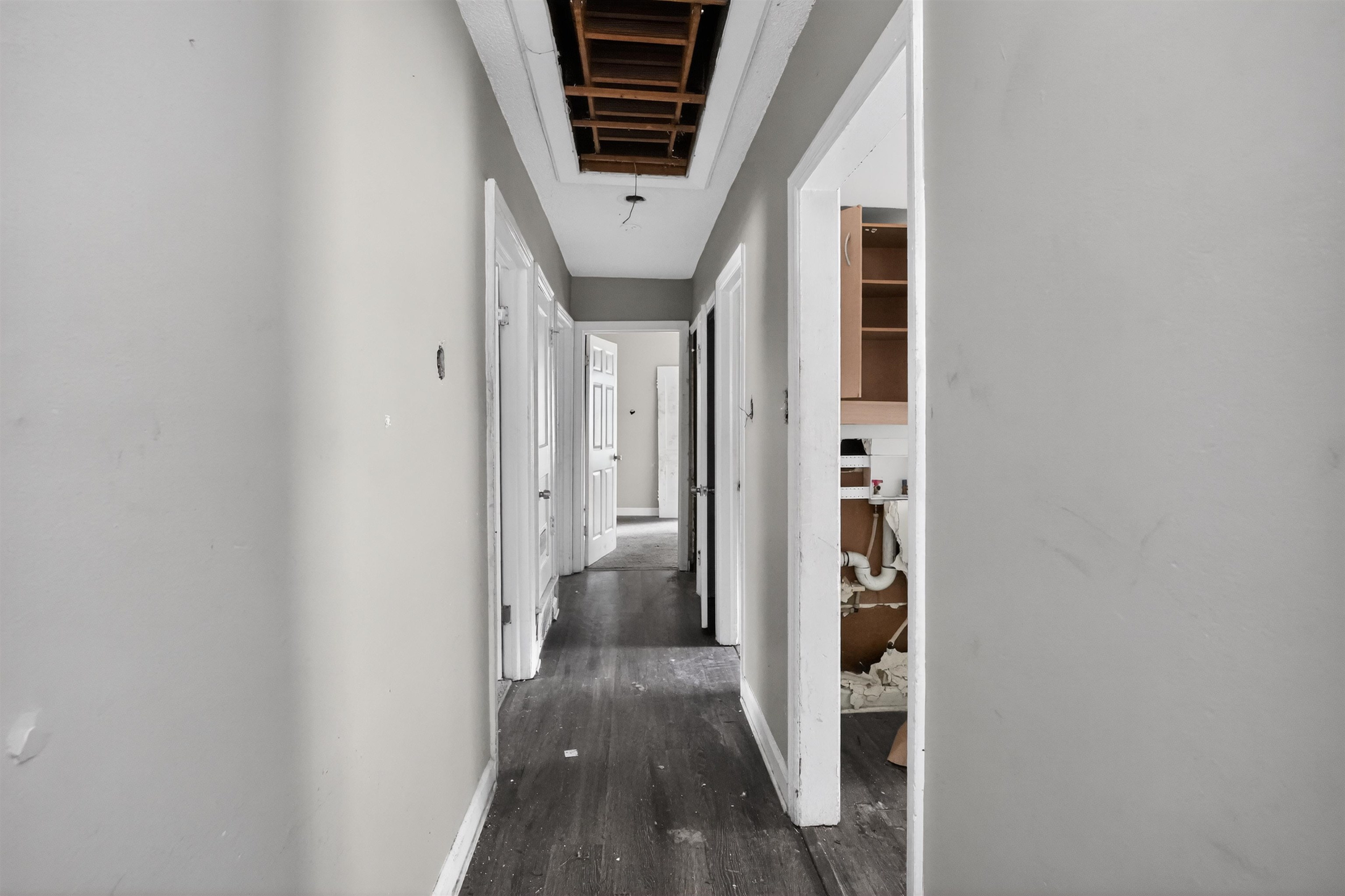 949 Sumter Street Memphis, TN 38122 - Photo 33 of 33 Interior hallway featuring wood-finish flooring and multiple doorways