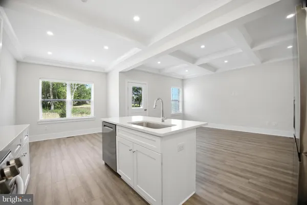 a kitchen with a sink and window