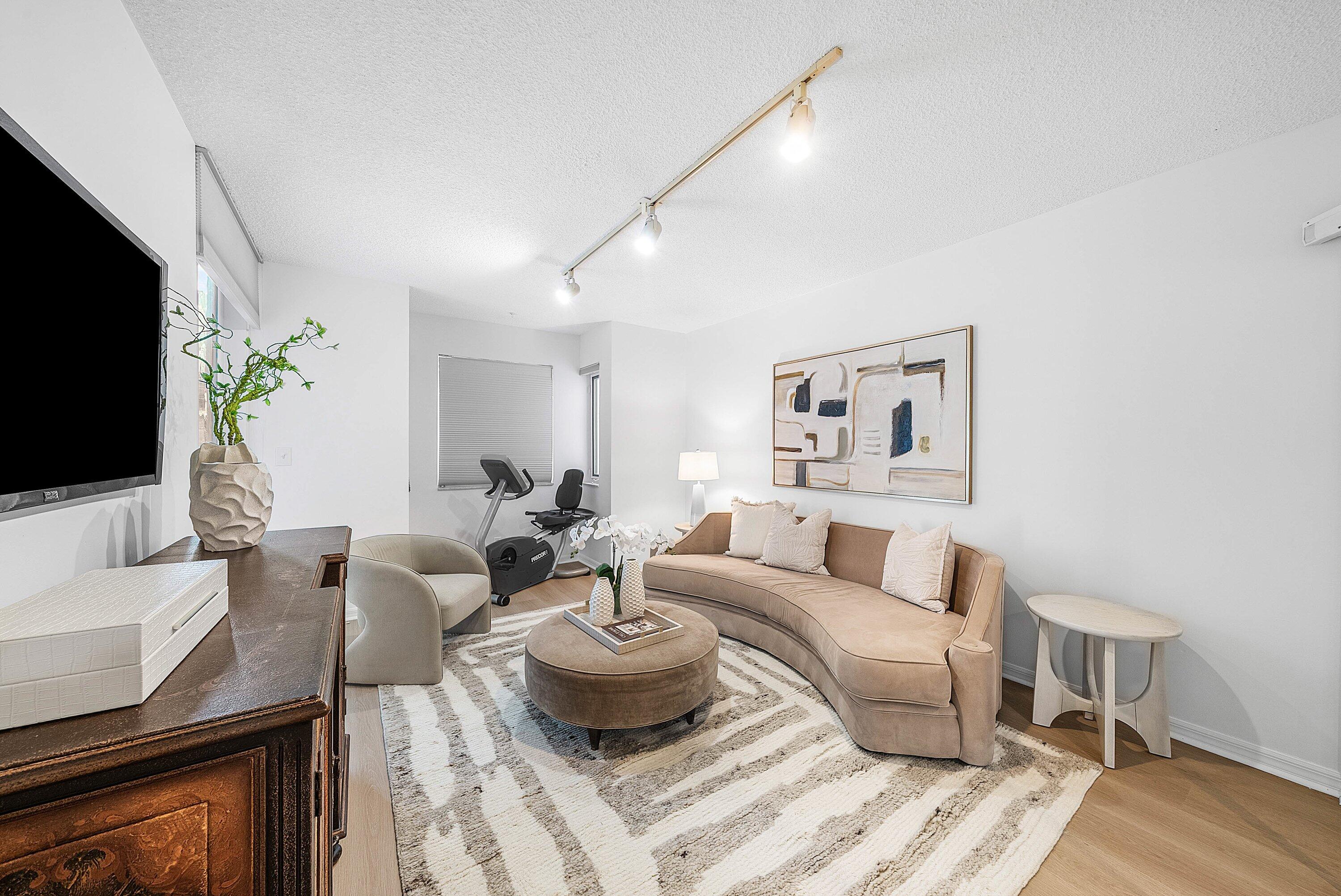 100 Southeast 5th Avenue, Unit 210 Boca Raton, FL 33432 - Photo 14 of 46 a living room with furniture and a flat screen tv