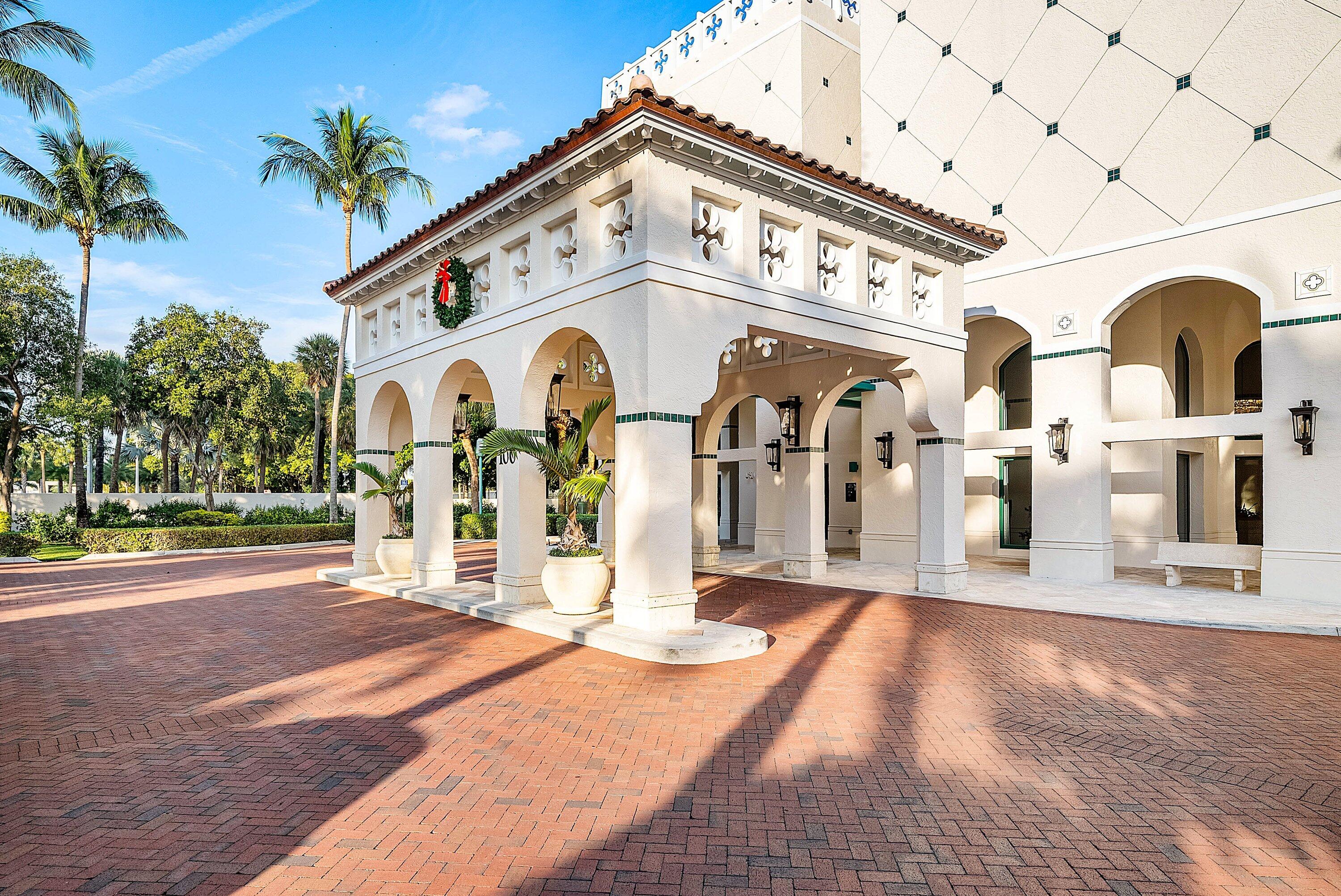 100 Southeast 5th Avenue, Unit 210 Boca Raton, FL 33432 - Photo 20 of 46 a view of a white building with a large tree