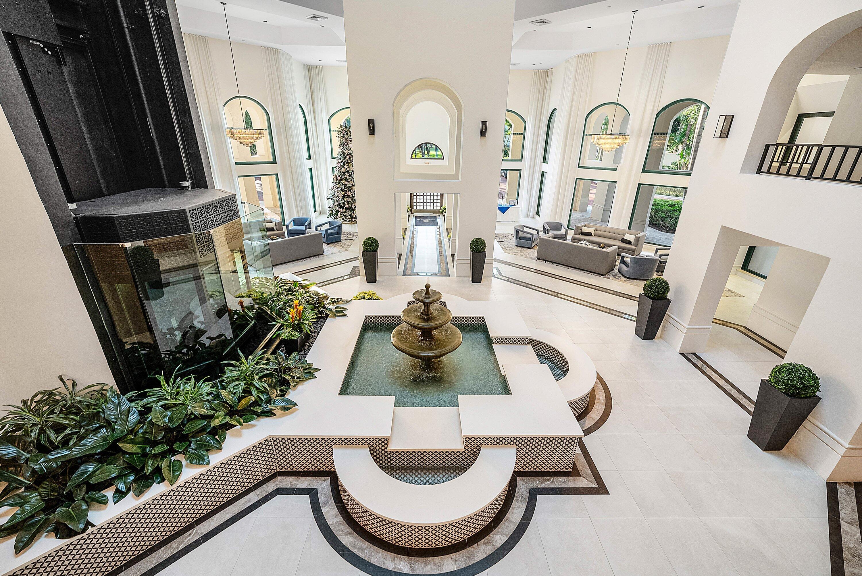 100 Southeast 5th Avenue, Unit 210 Boca Raton, FL 33432 - Photo 22 of 46 a view of living room with furniture and a floor to ceiling window