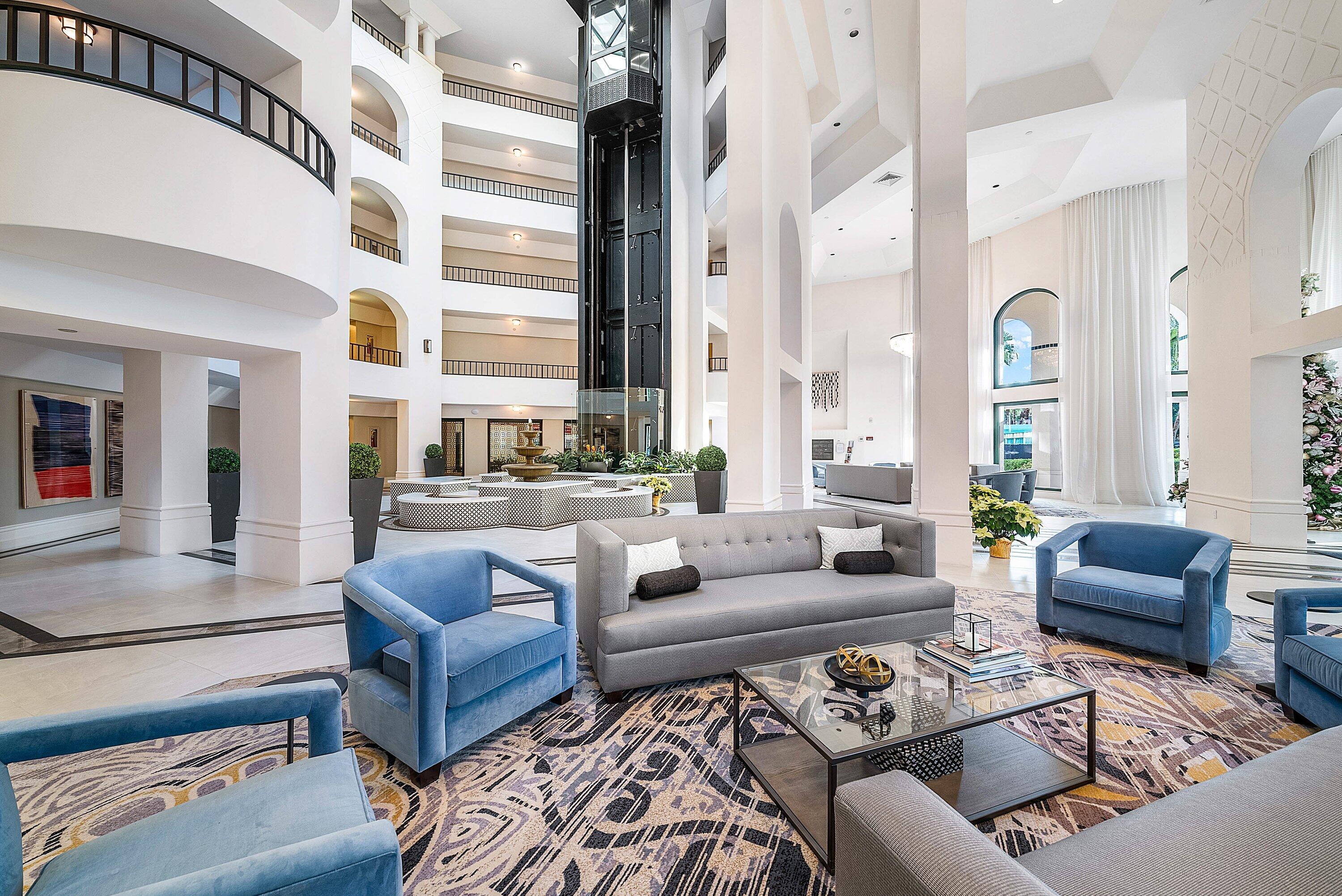 100 Southeast 5th Avenue, Unit 210 Boca Raton, FL 33432 - Photo 24 of 46 a living room with furniture wooden floor and a large window