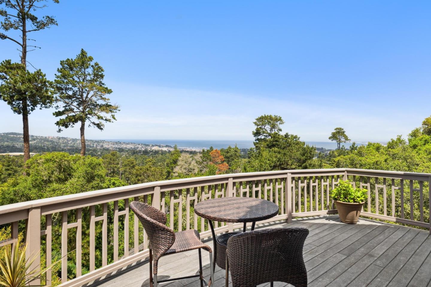a view of a two chair and table in the balcony