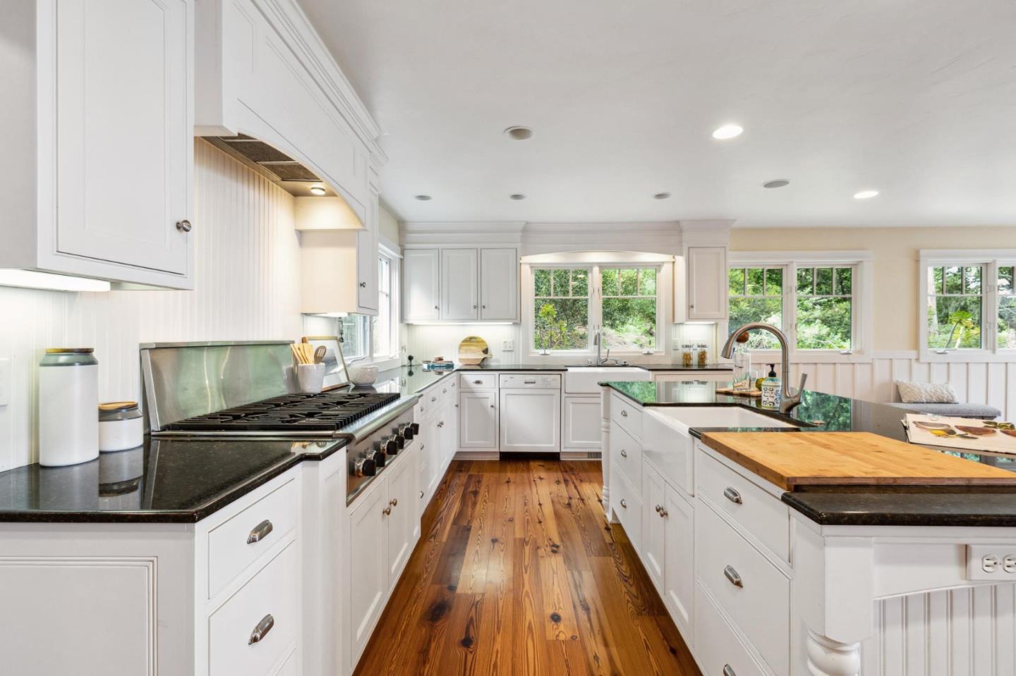23865 Fairfield Place Carmel, CA 93923 - Photo 17 of 58 a kitchen with a sink a counter top space a large window and stainless steel appliances