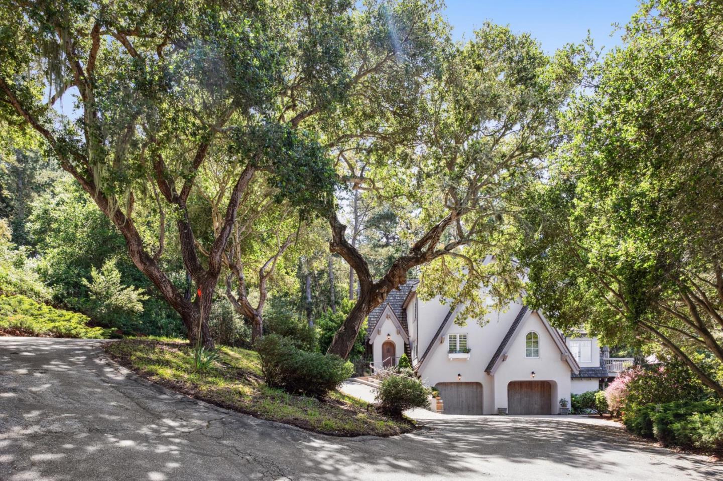 23865 Fairfield Place Carmel, CA 93923 - Photo 2 of 58 a house with a tree in front of it