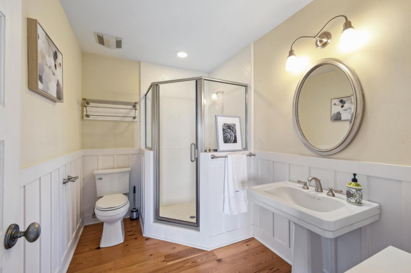 23865 Fairfield Place Carmel, CA 93923 - Photo 26 of 58 a bathroom with a sink a toilet and a mirror