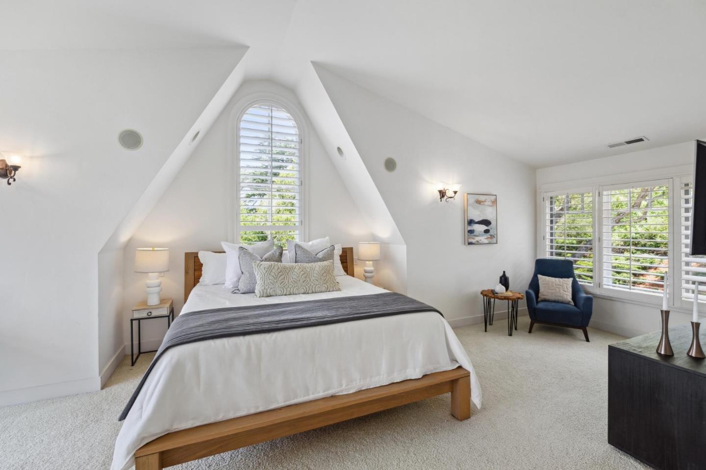 23865 Fairfield Place Carmel, CA 93923 - Photo 32 of 58 a bedroom with a large bed and windows