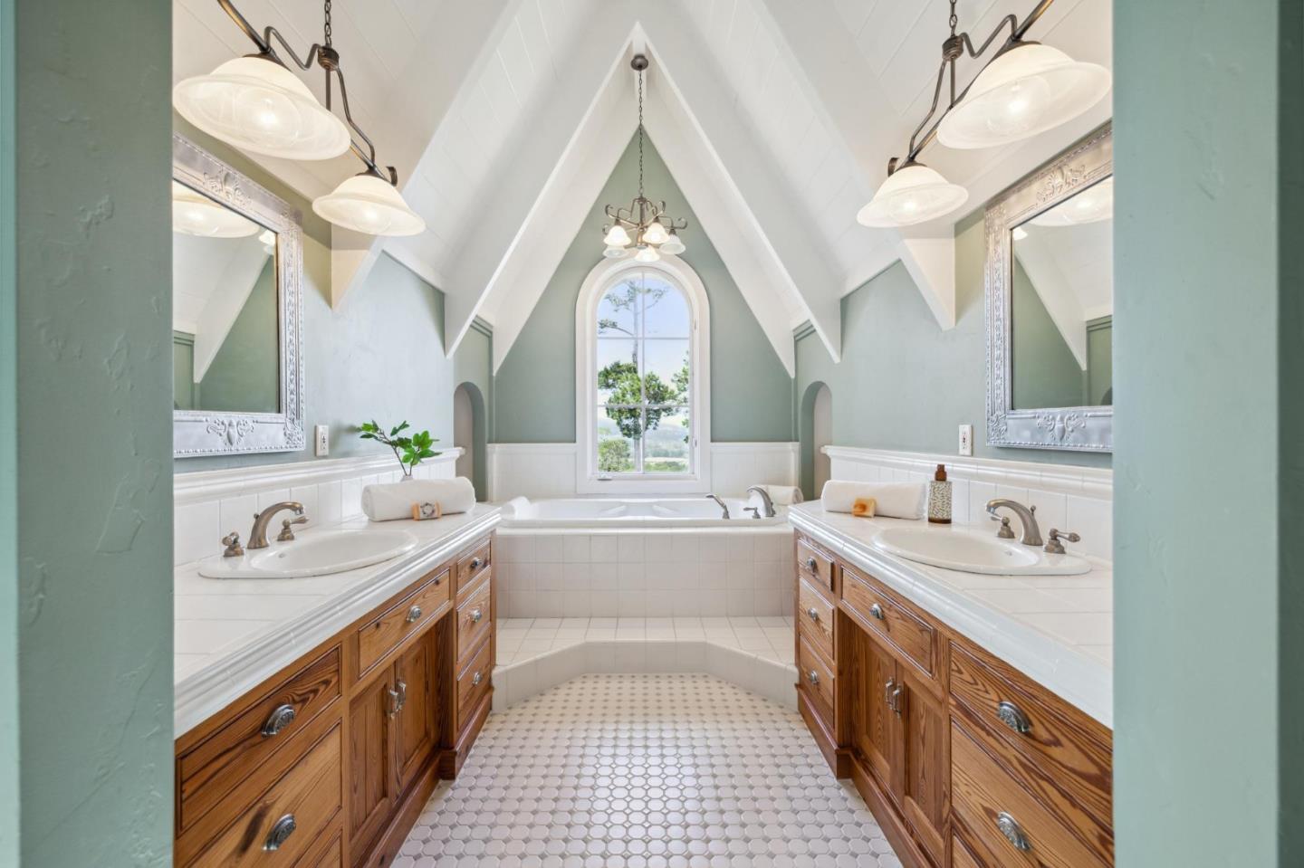 23865 Fairfield Place Carmel, CA 93923 - Photo 34 of 58 a bathroom with a double vanity sink mirror and a bathtub