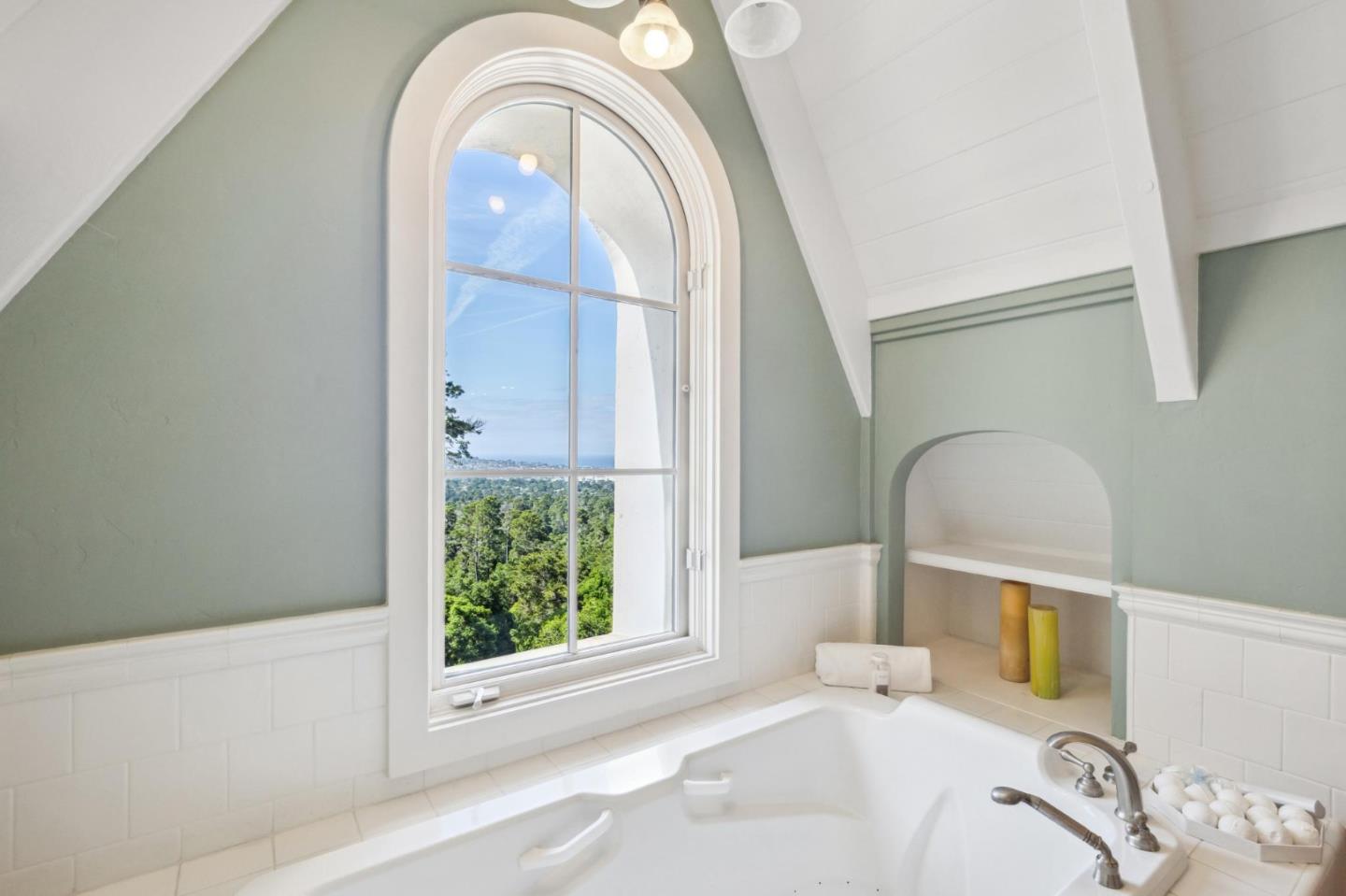 23865 Fairfield Place Carmel, CA 93923 - Photo 36 of 58 a bathroom with a sink a bathtub and next to a window