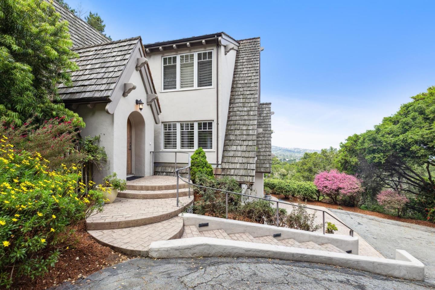 23865 Fairfield Place Carmel, CA 93923 - Photo 4 of 58 a front view of a house with a yard